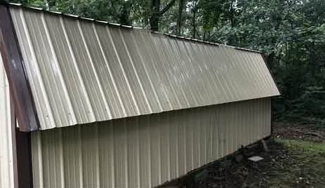 Metal barn roof after soft wash