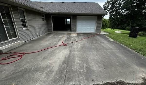 Driveway & pad before cleaning