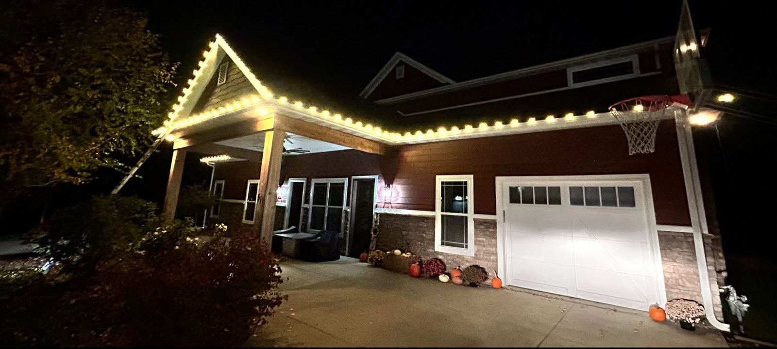 Same craftsman home lit at night